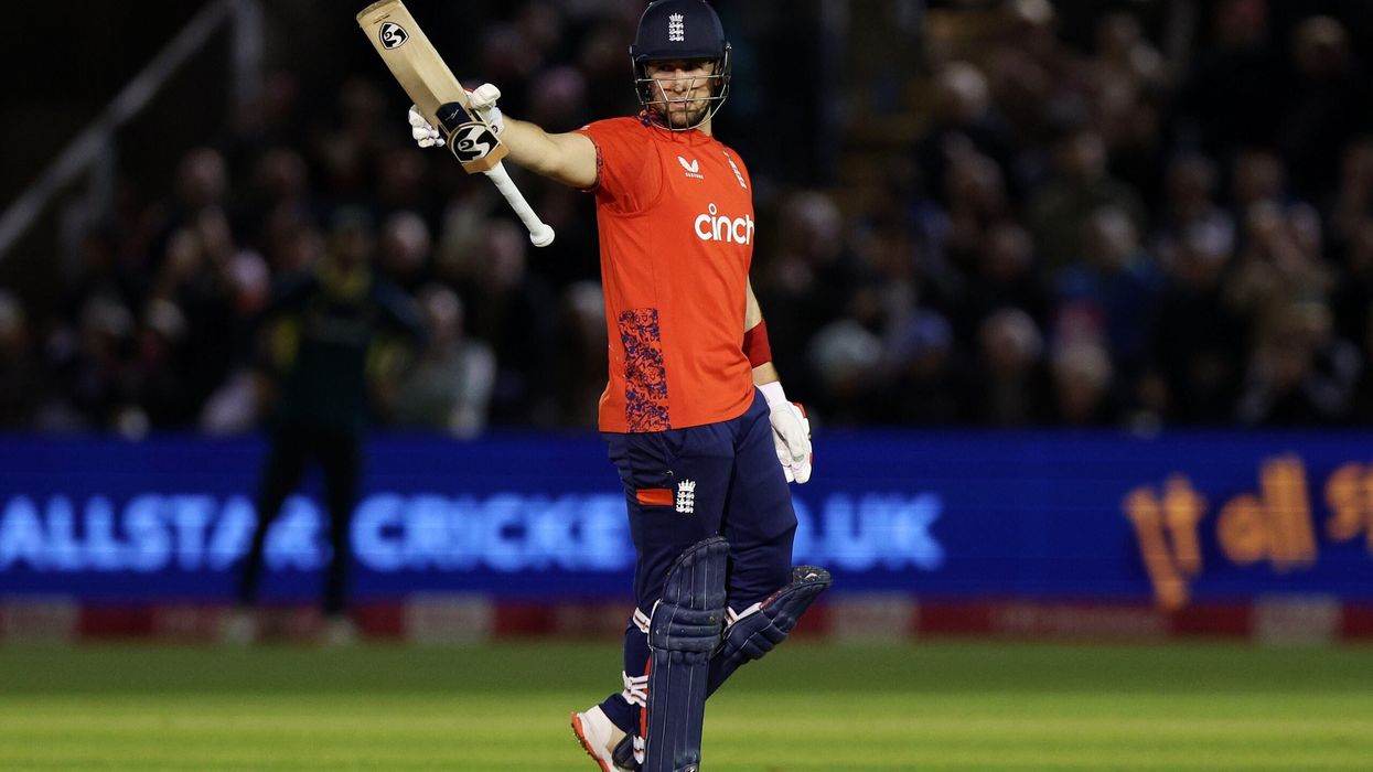 Liam Livingstone raises his bat as he celebrates reaching his half-century during the 2nd T20 match between England and Australia at Sophia Gardens on September 13 in Cardiff. (Photo: Getty Images)