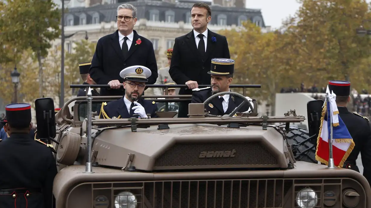 Macron and Starmer review troops aboard a command vehicle on the Place de l'Etoile, as part of the commemorations marking the 106th anniversary of the November 11, 1918, Armistice, ending World War I (WWI), in Paris, on November 11, 2024. (Photo: Getty Images)