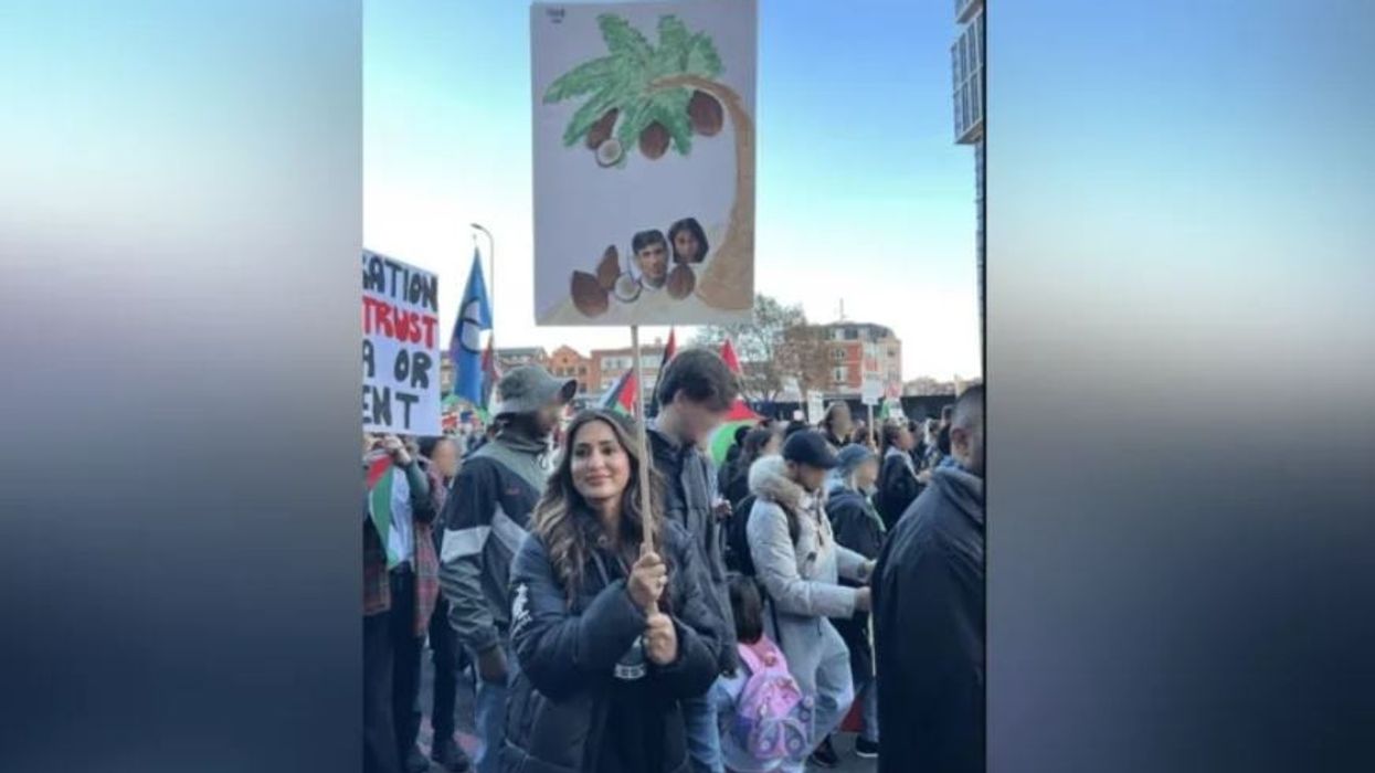 Teacher cleared of racism charge over ‘coconut placard’