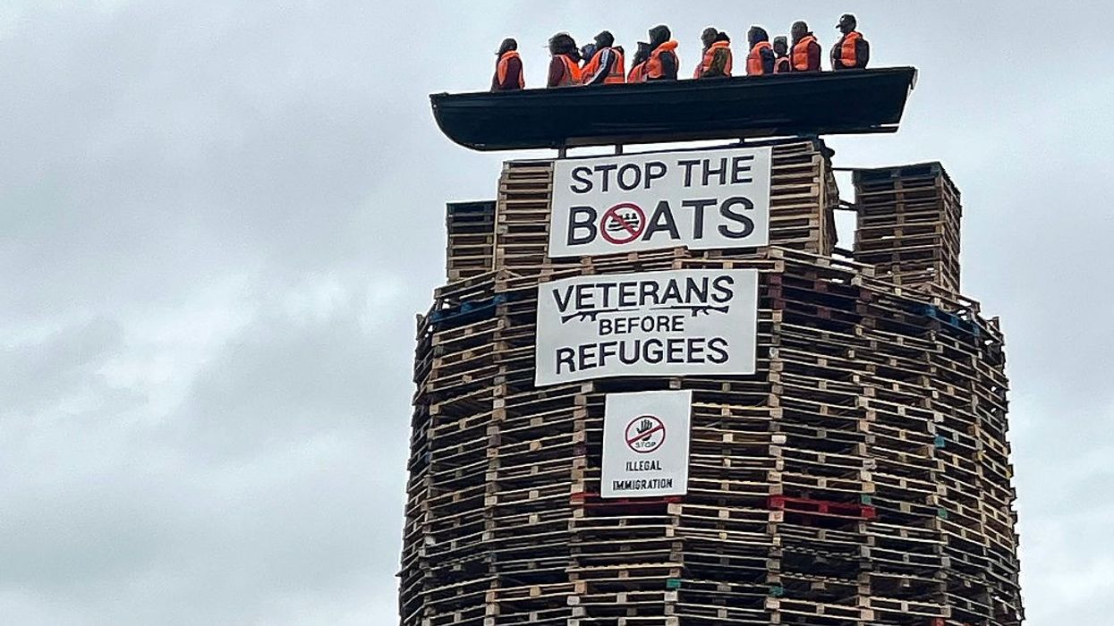 Police probe hate crime over migrant effigies bonfire in Northern Ireland