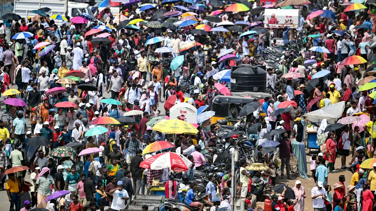 People arrive to watch the Indian Air Force (IAF) airshow ahead of the Indian Air Force day celebrations at Marina beach in Chennai on October 6, 2024. (Photo: Getty Images)