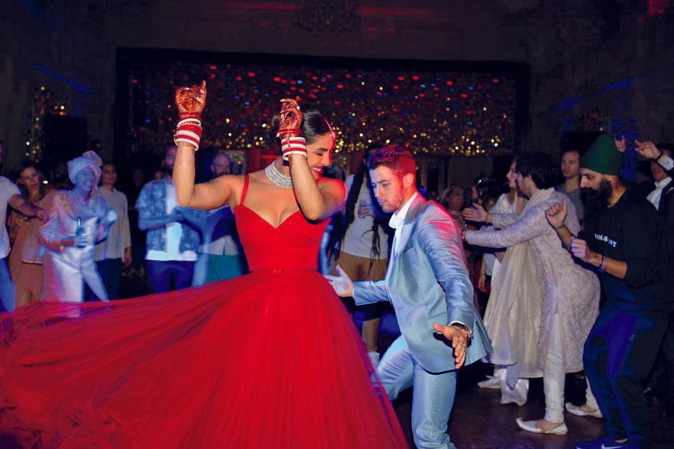 Priyanka Chopra Jonas dancing with husband Nick Jonas at the reception to their Indian Wedding p1eu8ojs1o1obn2db1fglkpe3a6 0