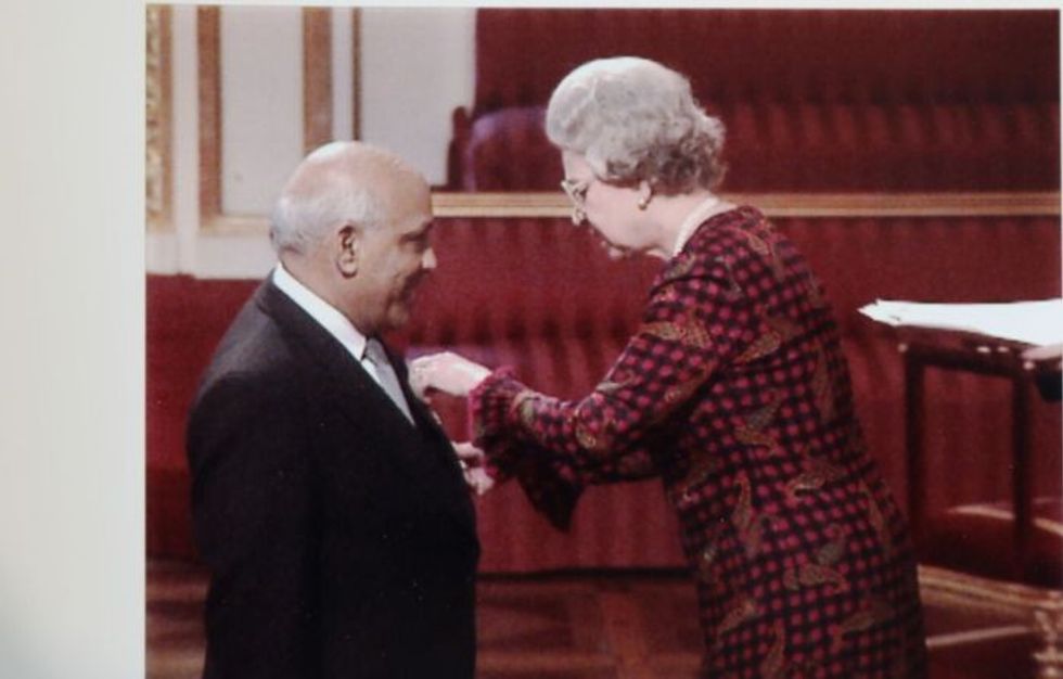 Queen felicitates Jagdish Sharma
