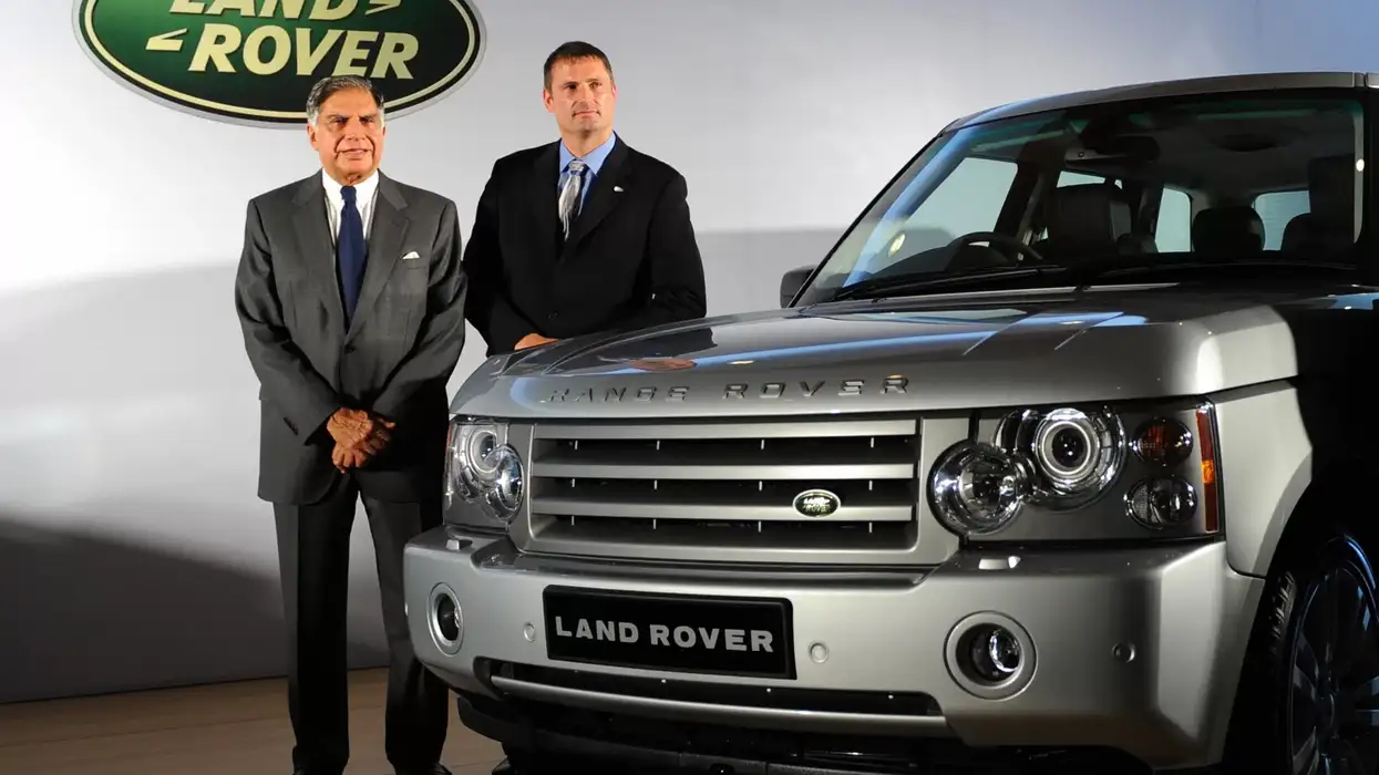 Ratan Tata and Land Rover Managing Director Phil Popham pose with a Range Rover during a press conference to announce JLR's Indian market debut in Mumbai on June 28, 2009. (Photo: Getty Images)
