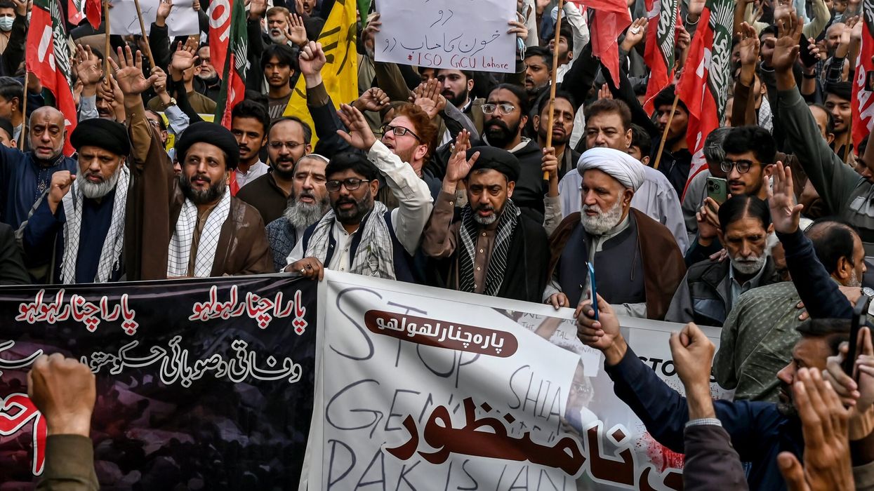 Shiite Muslims hold placards and shout slogans during a protest march against the sectarian attacks in Kurram district in Parachinar, the mountainous Khyber Pakhtunkhwa province, in Lahore on November 22, 2024. Thousands of Shiite. (Photo: Getty Images)