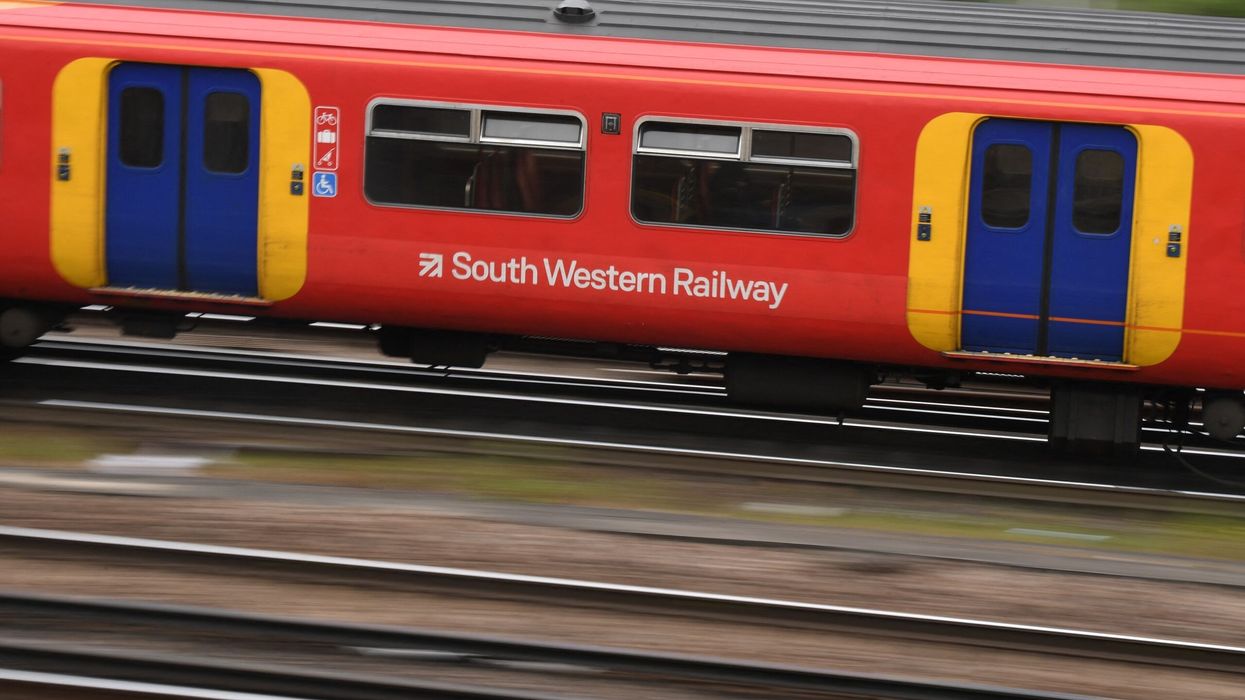 South Western trains travel past Clapham Junction station  in London on May 20, 2021. (Photo: Getty Images)