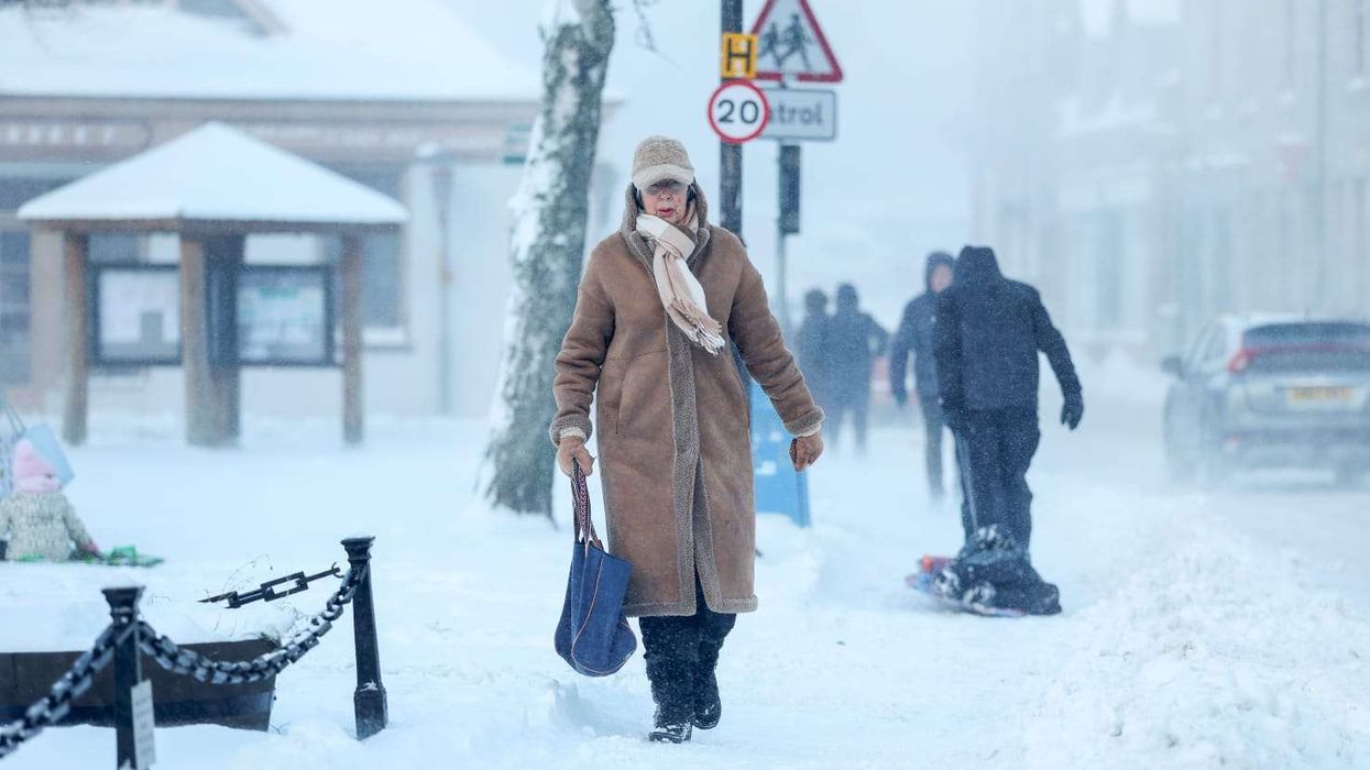 Heavy snow forces school closures and flight cancellations in parts of UK