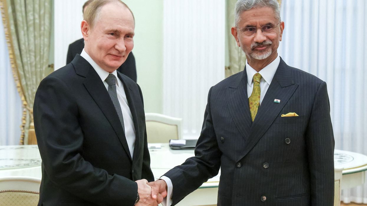 Vladimir Putin shakes hands with Indian foreign minister Subrahmanyam Jaishankar