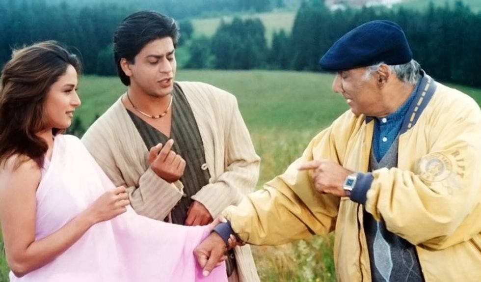 Y Shah Rukh Khan Madhuri Dixit and Yash Chopra on the sets of Dil Toh Pagal Hai