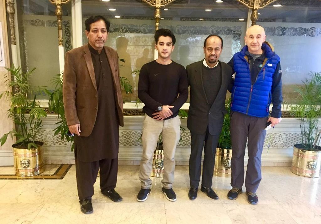 Alex Goldfarb poses for a photo with members of Alpine Club of Pakistan in Islamabad, Pakistan December 29, 2020. Karrar Haidri/Alpine Club of Pakistan/Handout via REUTERS