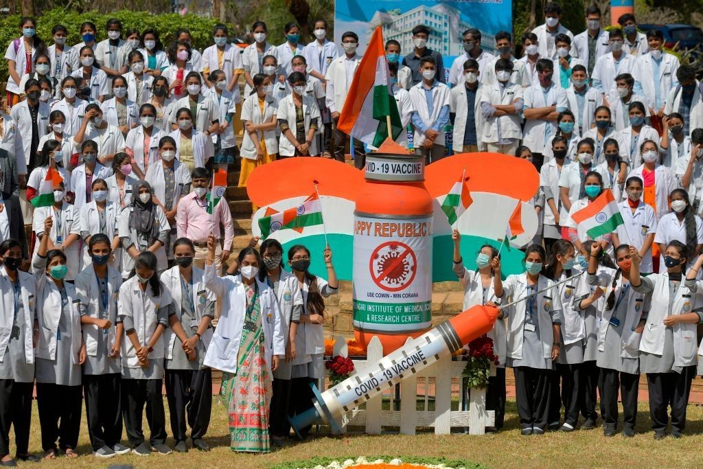 Students and staff of a medical college take part in an awareness campaign for the Covid-19 coronavirus vaccination on the eve of Indias Republic Day in Bangalore on January 25, 2021. (Photo by MANJUNATH KIRAN/AFP via Getty Images)