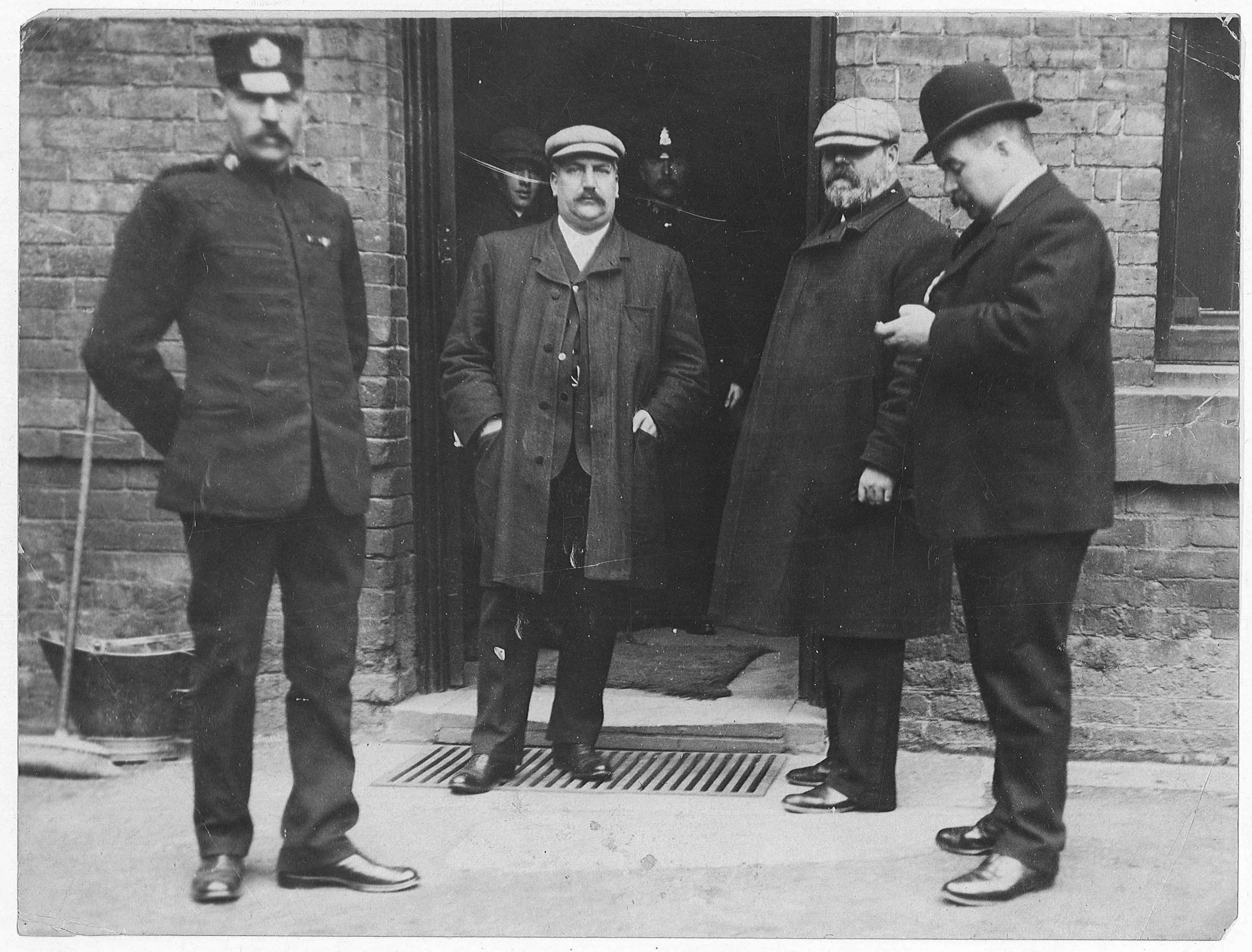 TRUE STORY: Inspector Campbell (second from left) and two other policemen outside a house in Great Wyrley, investigating the case of George Edalji. (Photo credit: Credit: Staffordshire Records Office)