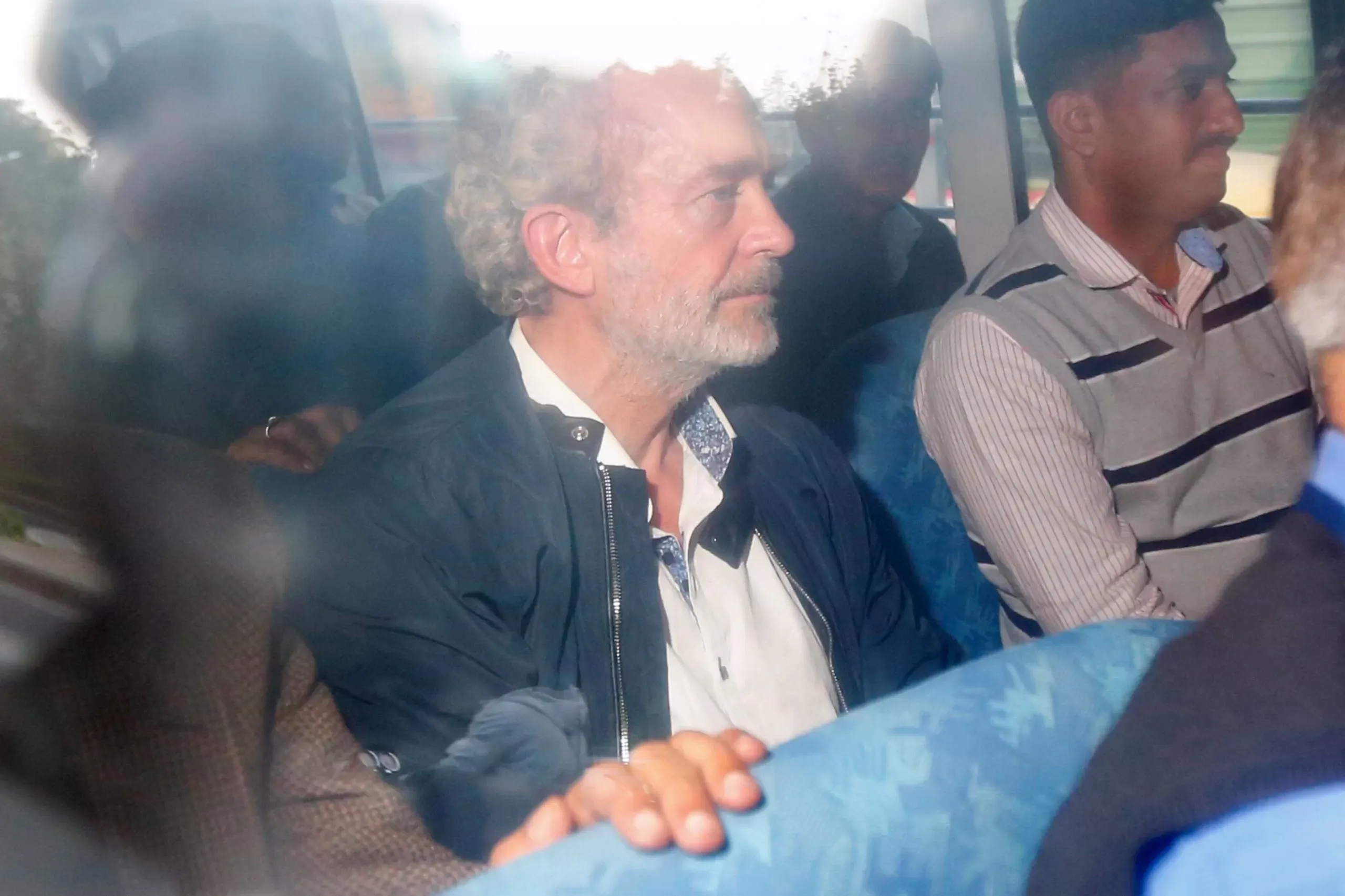 British national Christian Michel James (C) (AFP via Getty Images)