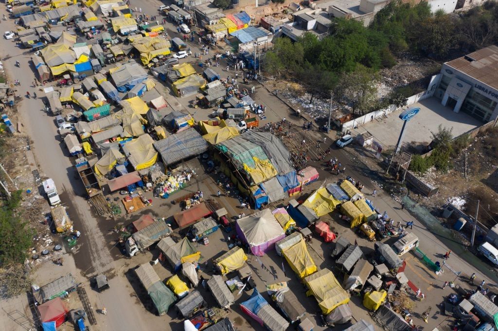 In this aerial picture taken on March 4, 2021, farmers campsites are seen blocking a highway at the Delhi-Haryana state border in Singhu as farmers continue to demonstrate against the central government's recent agricultural reforms.(Photo by XAVIER GALIANA/AFP via Getty Images)