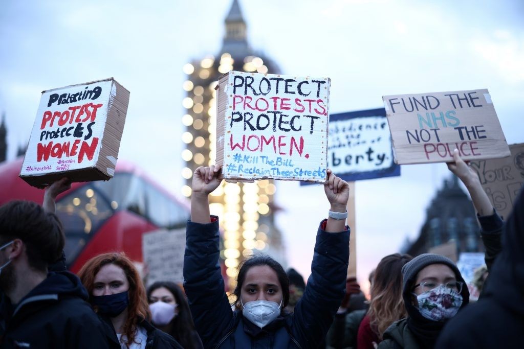 Women hold signs during a protest, following the kidnap and murder of Sarah Everard, in March, 2021