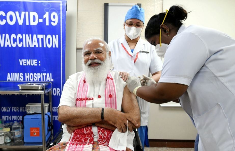 India's Prime Minister Narendra Modi receives a dose of COVAXIN, a coronavirus disease (COVID-19) vaccine developed by India's Bharat Biotech and the state-run Indian Council of Medical Research, at All India Institute of Medical Sciences (AIIMS) hospital in New Delhi, India, March 1, 2021. India's Press Information Bureau/Handout via REUTERS