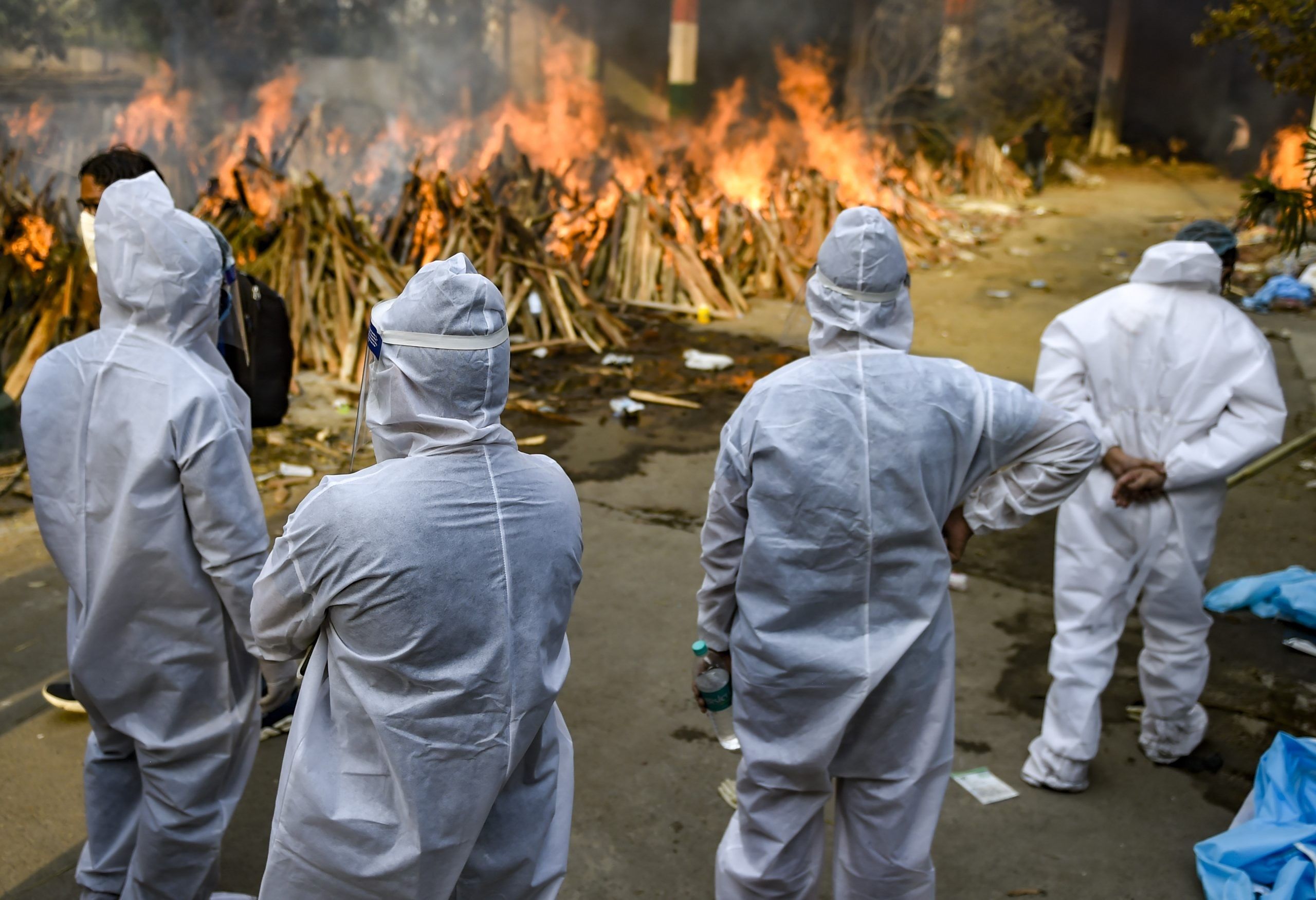 Mass cremation of Covid-19 victims at Gazipur Crematorium in New Delhi. (PTI Photo)