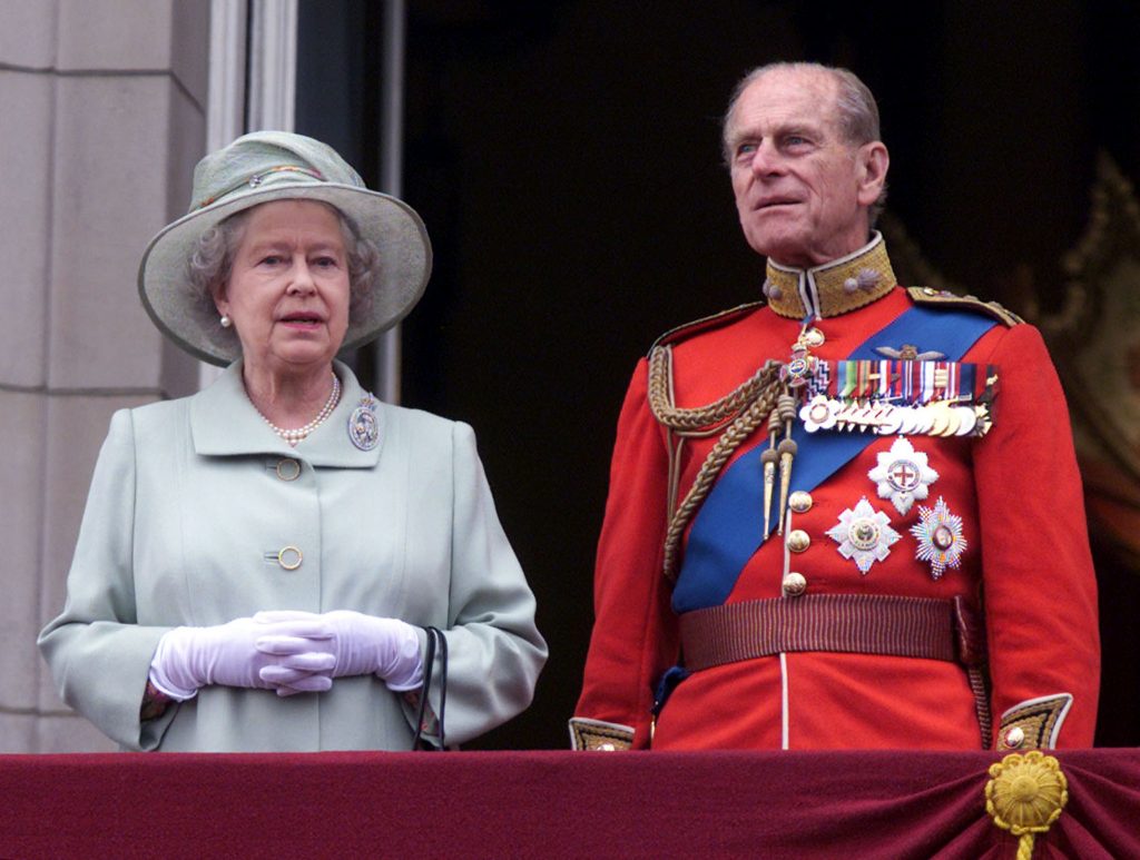 Queen Elizabeth stands and the late Prince Philip, the Duke of Edinburgh at Buckingham Palace for the Trooping the Colour ceremony