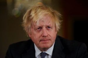 Four top aides desert embattled Johnson