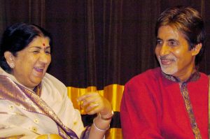 Late Mangeshkar with Amitabh Bachchan (credit: Indranil Mukherjee/AFP/Getty Images)