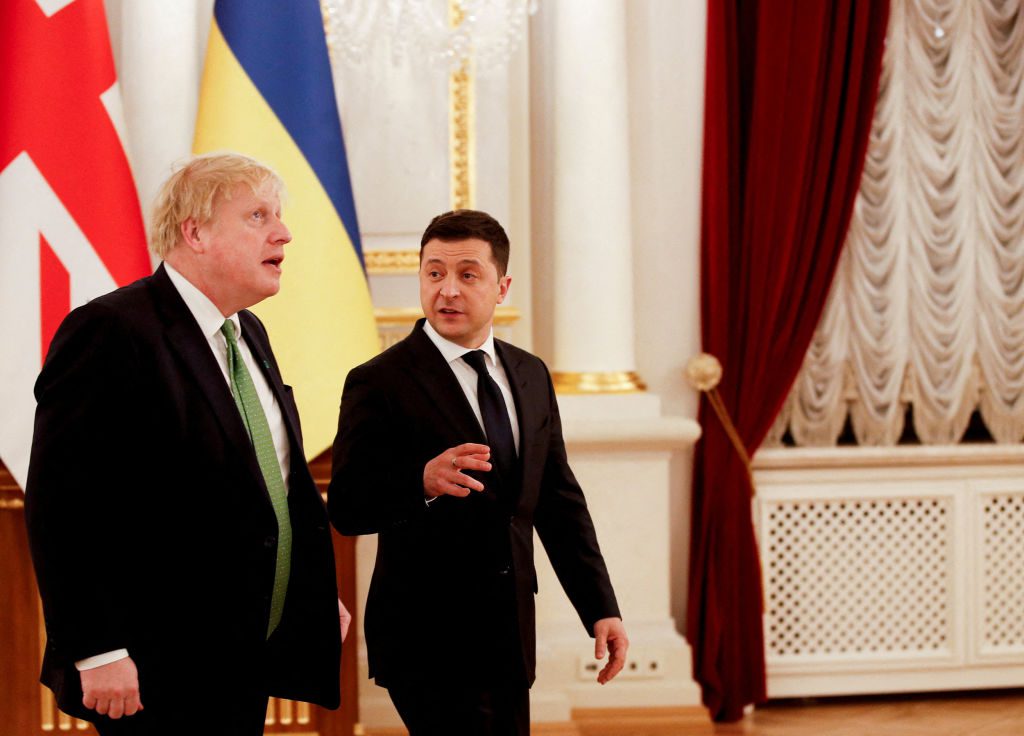 British Prime Minister Boris Johnson (L) is greeted by Ukraine's President Volodymyr Zelenskyy at the Presidential Palace