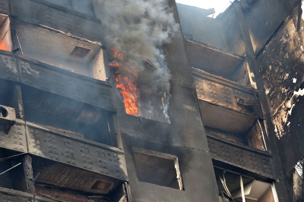 A building burns after Russian troops shelled the area in the second largest Ukrainian city