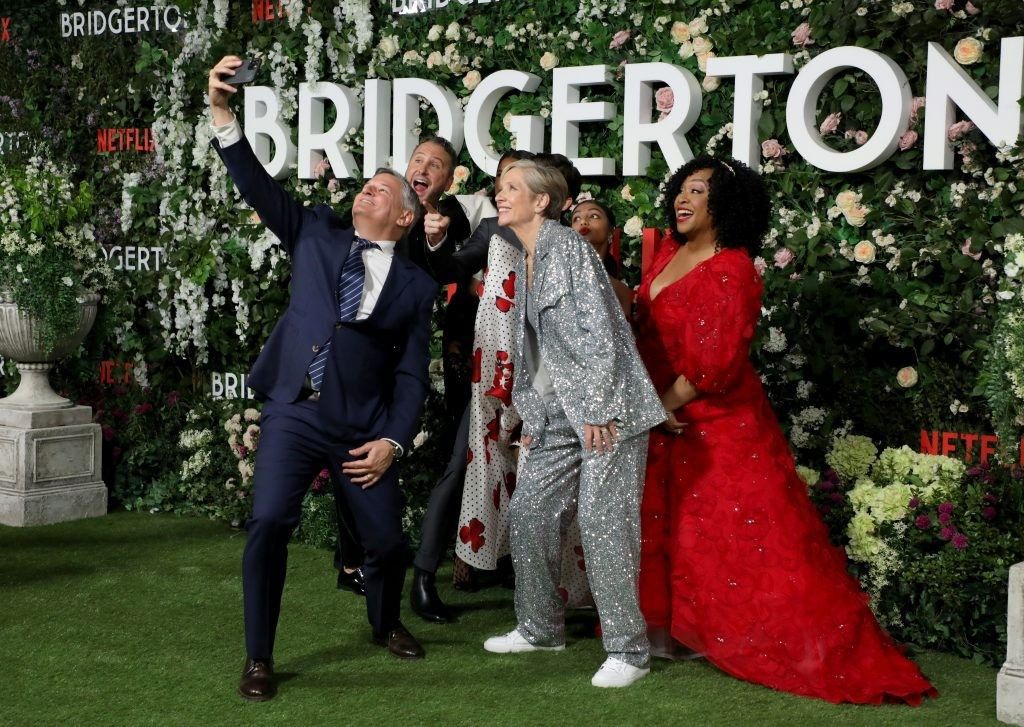 Ted Sarandos, Chris Van Dusen, Simone Ashley, Betsy Beers, Jonathan Bailey, Charithra Chandran and Shonda Rhimes attend the "Bridgerton" Series 2 World Premiere at Tate Modern on March 22, 2022 in London, England.