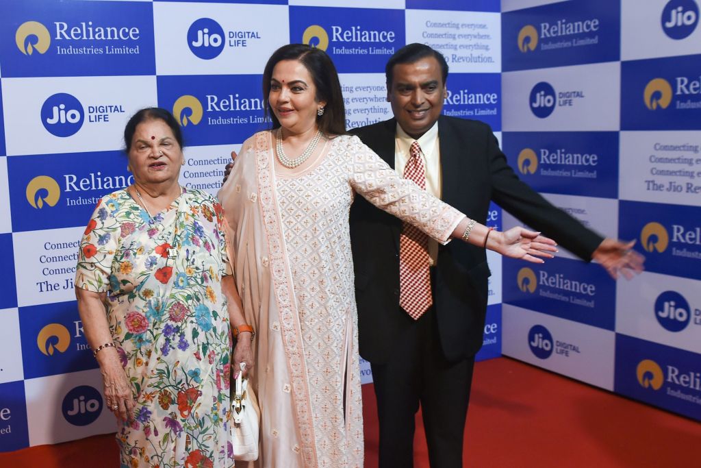 photo of Reliance Industries chairman Mukesh Ambani (R) along with his wife Nita Ambani (C) and mother Kokilaben (L) 