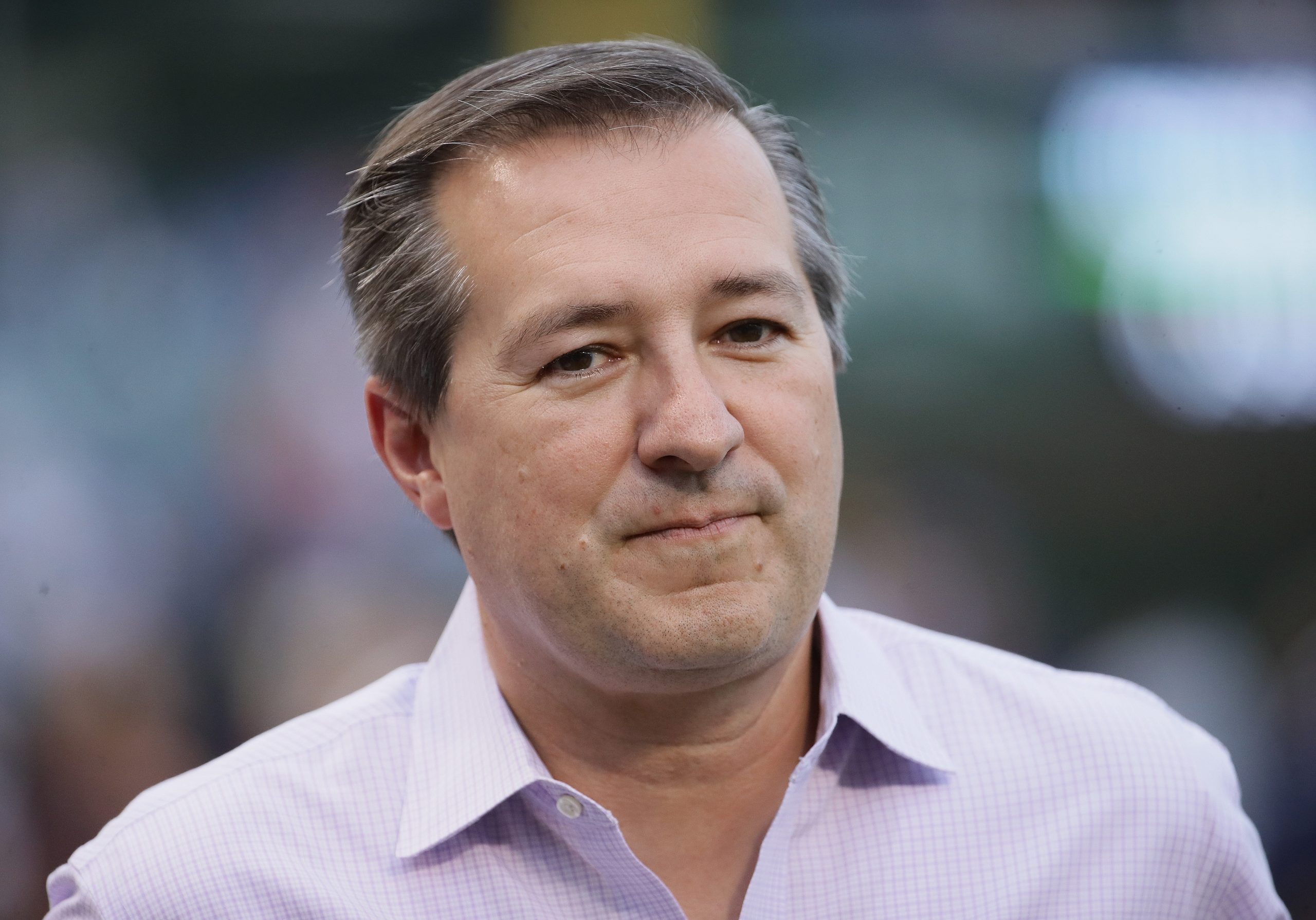 Owner Tom Ricketts of the Chicago Cubs is seen on the field before the Cubs take on the St. Louis Cardinals at Wrigley Field