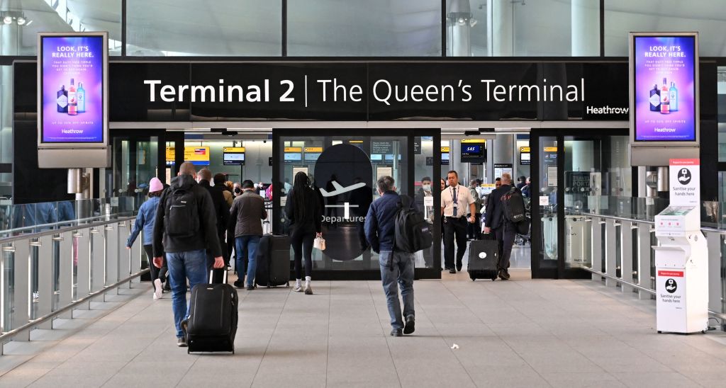 Holidaymakers and travellers arrive at Terminal 2 of London Heathrow Airport in west London, on April 6, 2022