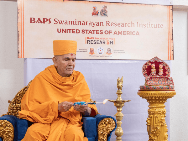 His Holiness Mahant Swami Maharaj, the spiritual leader of the BAPS Swaminarayan Sanstha, inaugurates the BAPS Swaminarayan Research Institute via live webcast from India by lighting the inaugural lamp (deep-pragatya) symbolising the spreading of the light of knowledge throughout the world