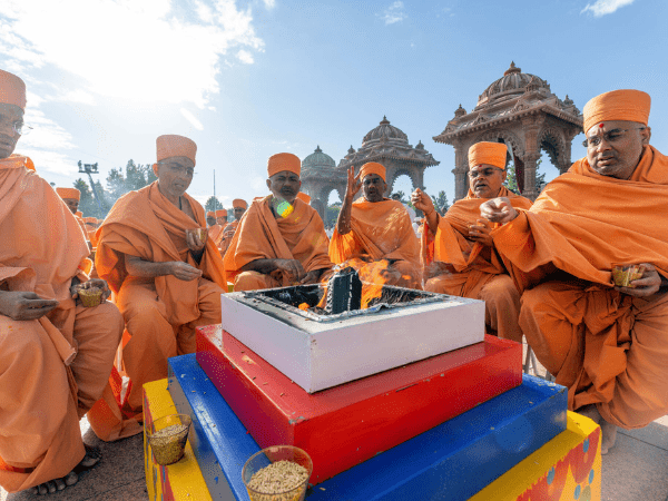 Pujya Swamis participate in the Satsang Diksha Homatmak Path during the inauguration of BAPS Swaminarayan Research Institute in Robbinsville, New Jersey, US